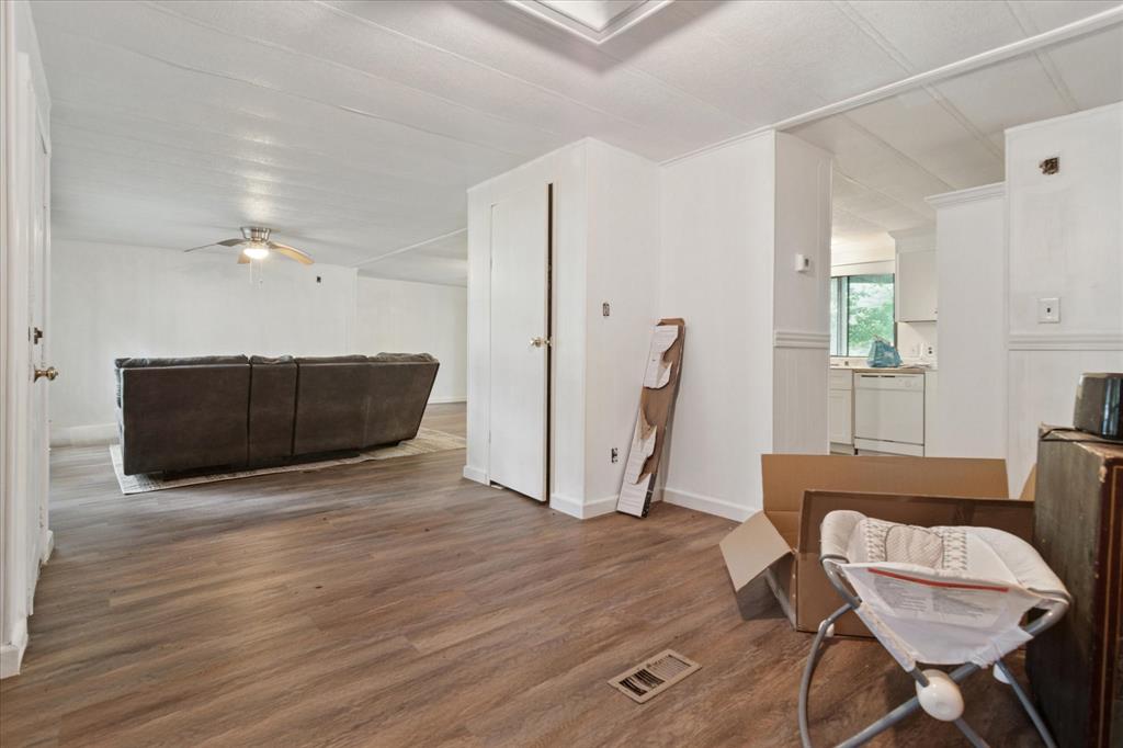 4806 Creekside Road Melissa, TX 75454 - Photo 3 of 10 a view of a livingroom with furniture and wooden floor