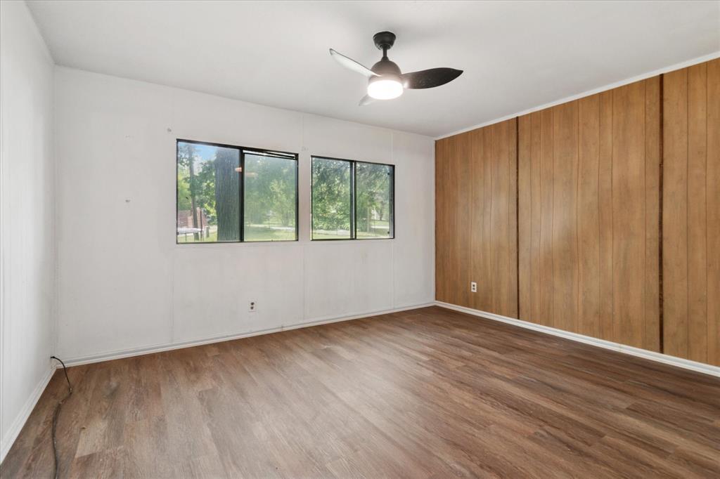 4806 Creekside Road Melissa, TX 75454 - Photo 6 of 10 wooden floor in an empty room with a window