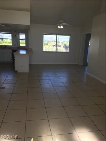 a view of an empty room and window in a room