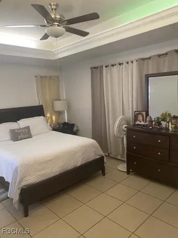 a bedroom with a bed and a mirror