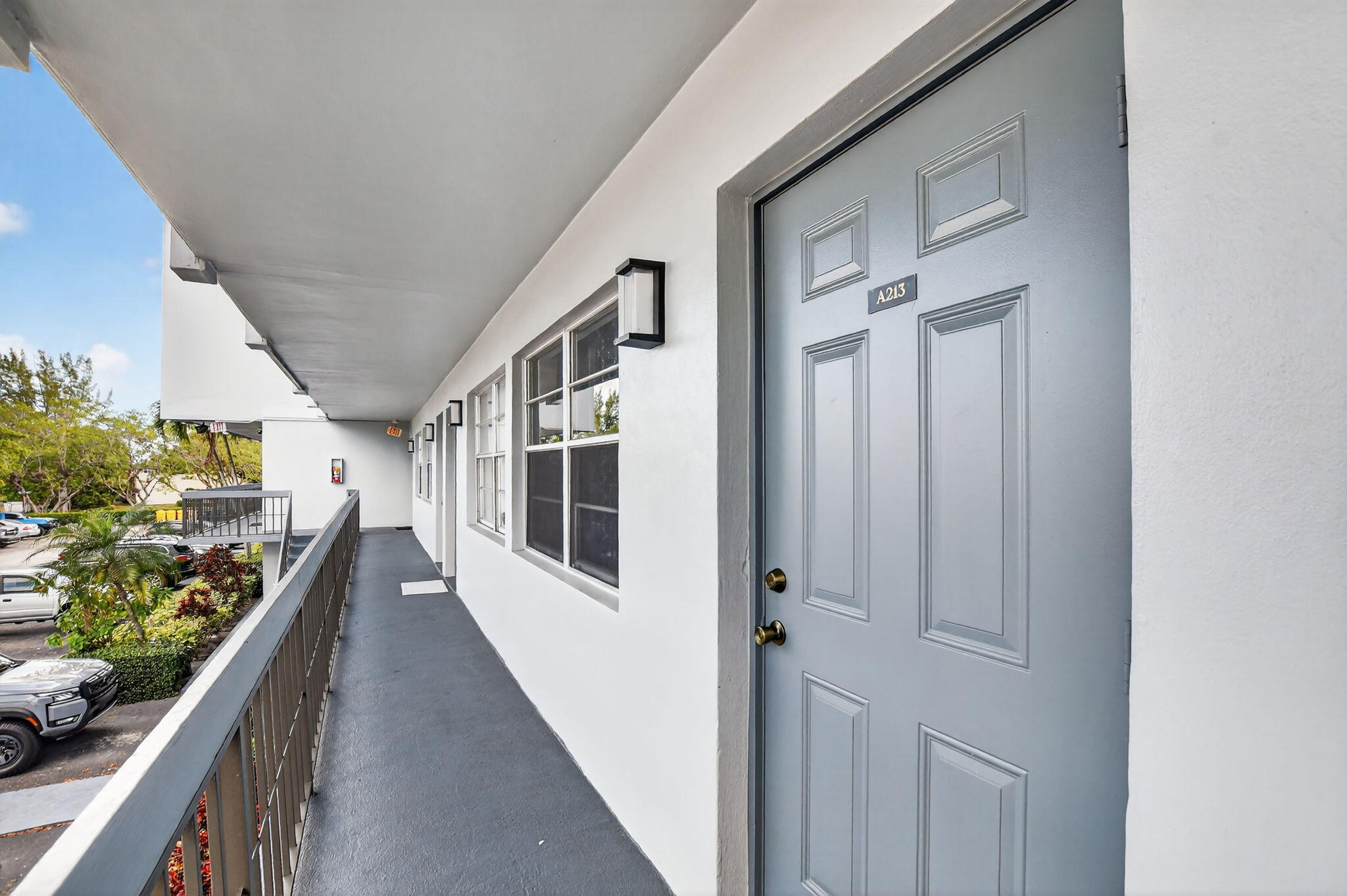 9500 Southwest 3rd Street, Unit 213 Boca Raton, FL 33428 - Photo 1 of 42 Exterior catwalk and stairs