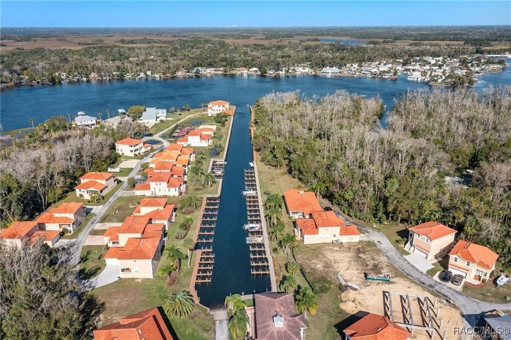 an aerial view of residential building and lake