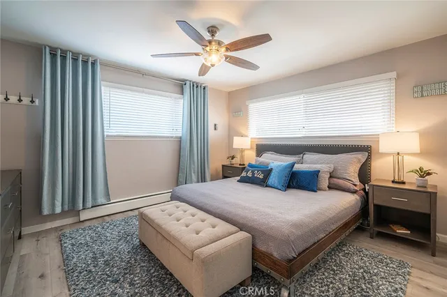 a bedroom with a large bed and a window