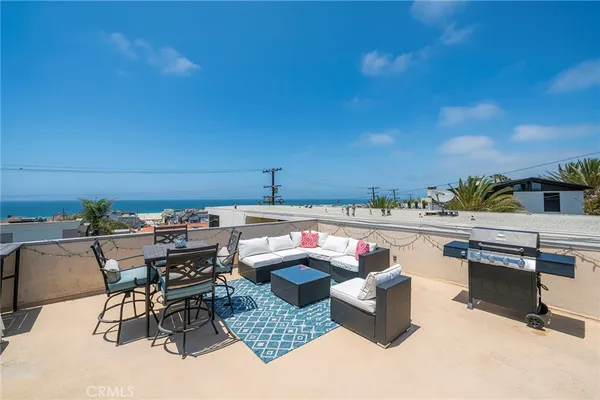 a outdoor living space with furniture and city view