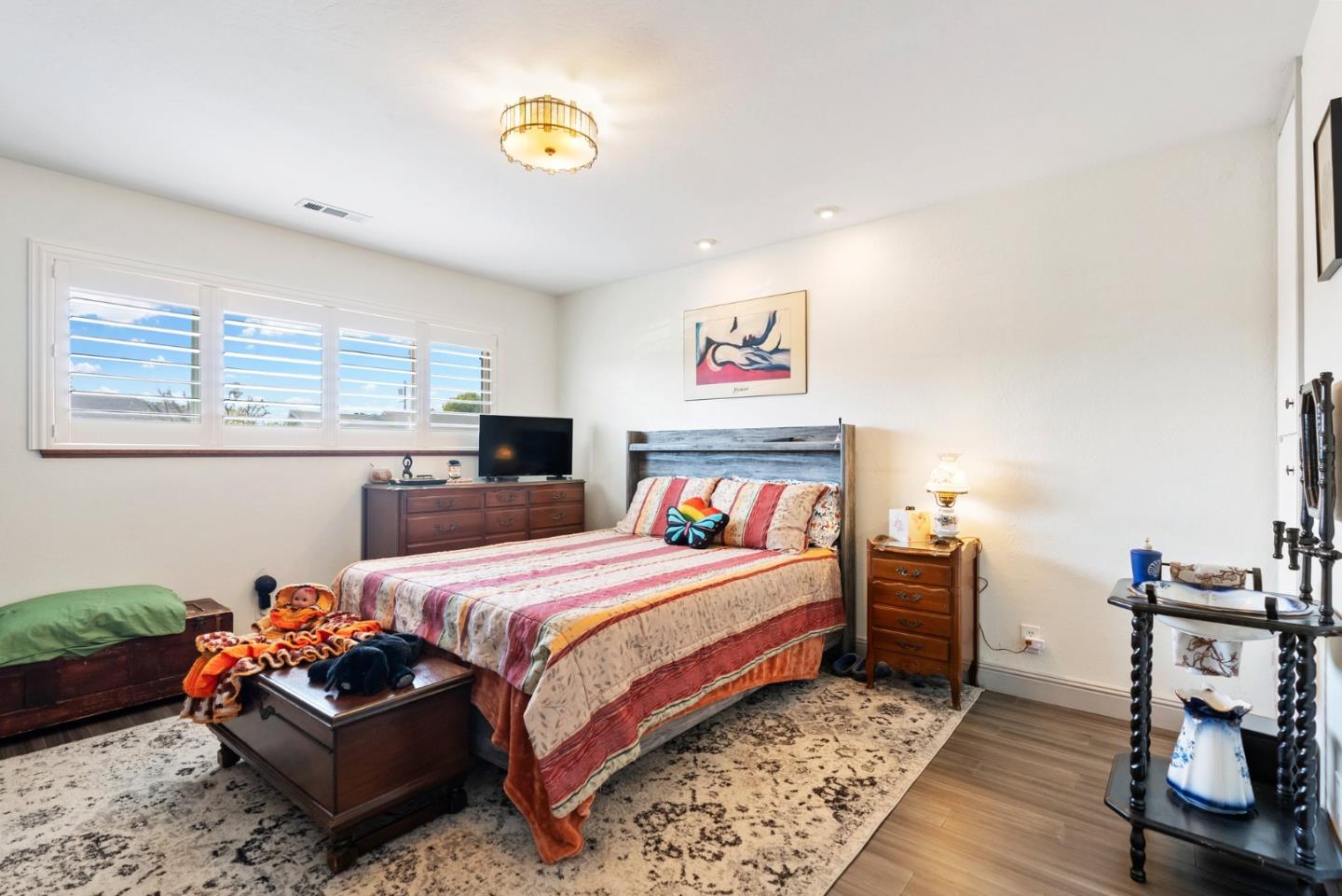 1650 Cambrian Drive Salinas, CA 93906 - Photo 25 of 48 a bedroom with a bed and a chandelier