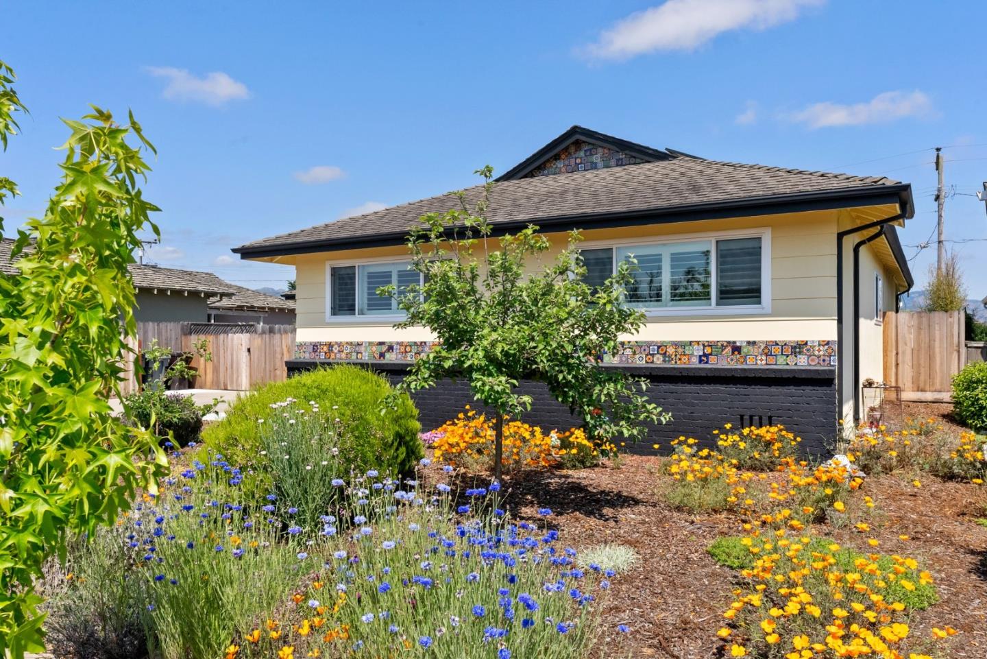 1650 Cambrian Drive Salinas, CA 93906 - Photo 7 of 48 a front view of a house with a yard and a garden