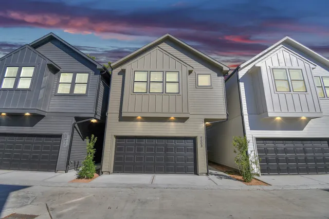 a front view of a house with garage