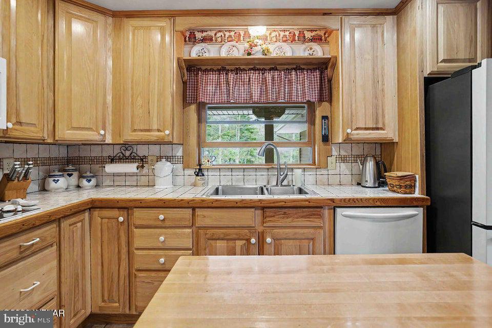 2270 Pine Tree Road Hughesville, PA 17737 - Photo 29 of 90 Warm wooden kitchen with natural light.