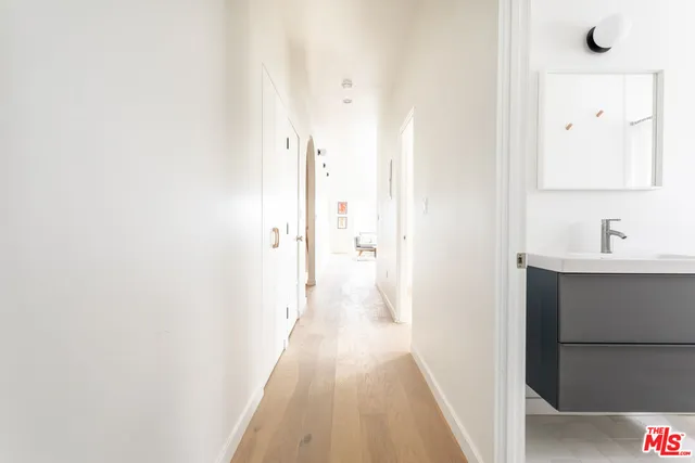 a view of a bathroom from a hallway