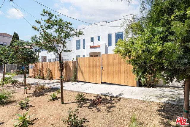 a view of a house with snow on the road