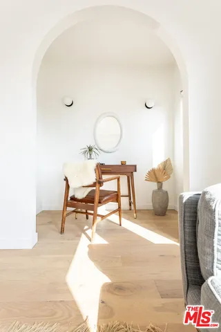 a bedroom with a bed and a table