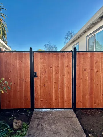 a view of a back yard with potted plants