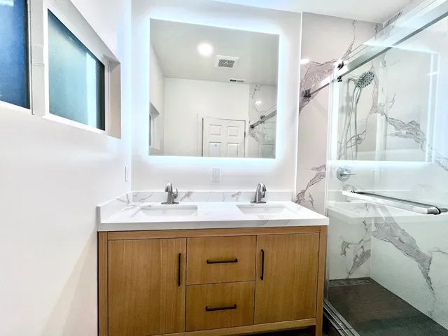 a bathroom with a sink and a mirror