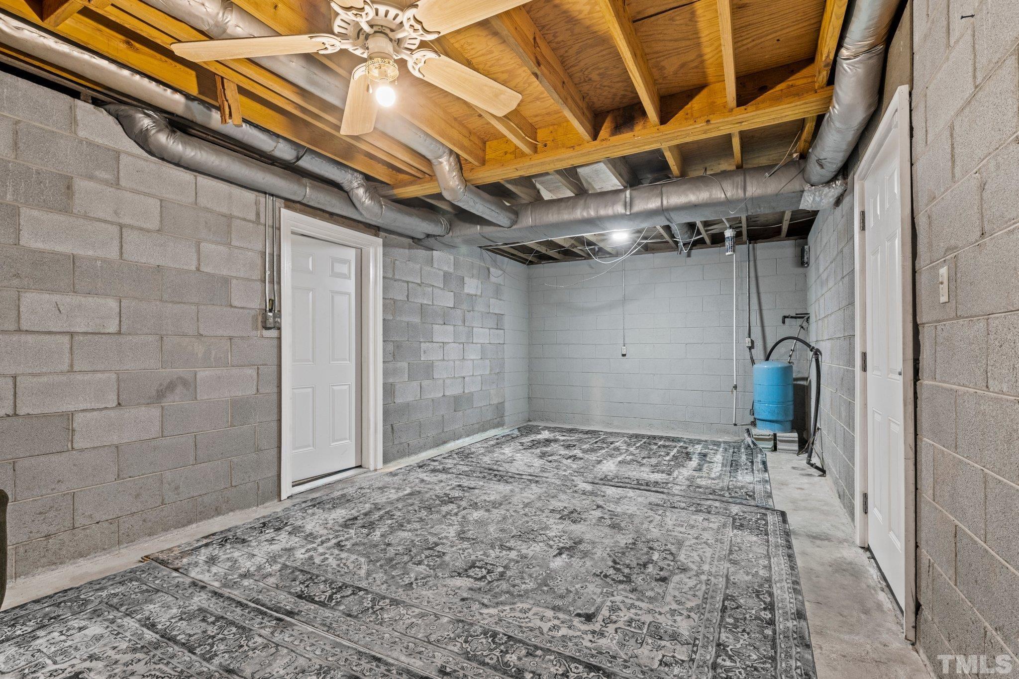 12233 Creedmoor Road Raleigh, NC 27613 - Photo 22 of 57 a view of a room with wooden floor