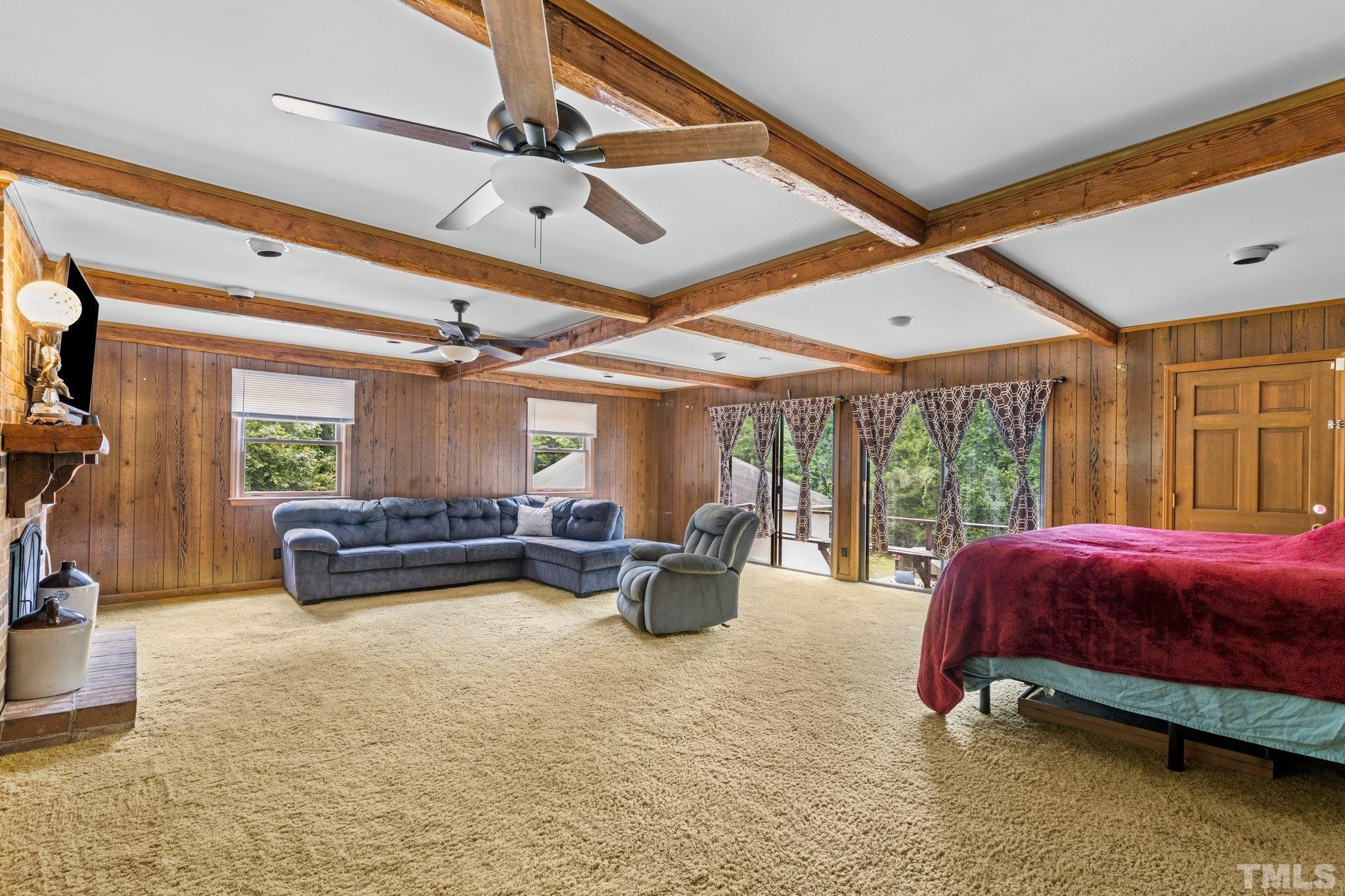 12233 Creedmoor Road Raleigh, NC 27613 - Photo 24 of 57 a bedroom with furniture and large windows