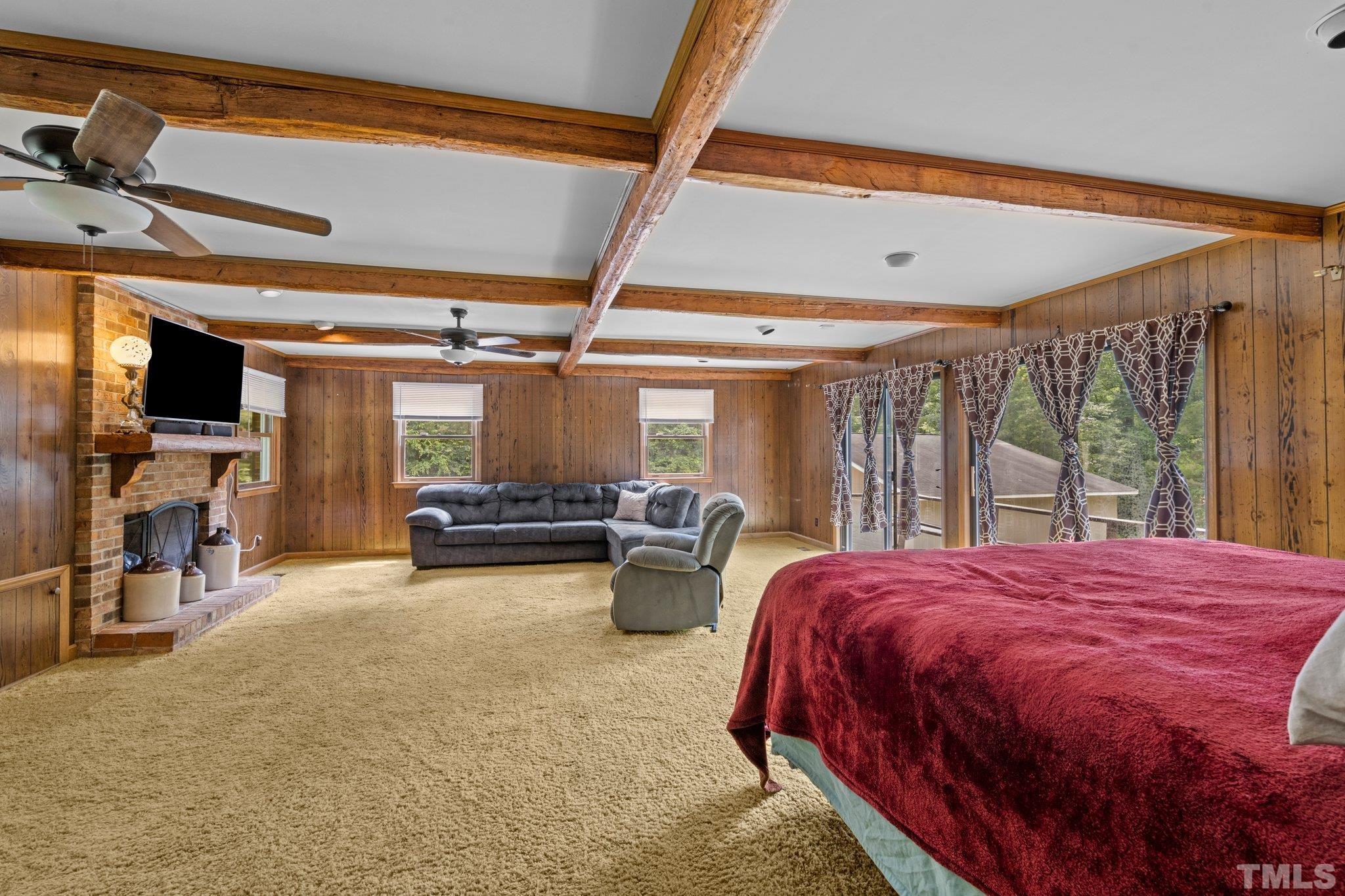 12233 Creedmoor Road Raleigh, NC 27613 - Photo 27 of 57 a bed room with a bed and a chair