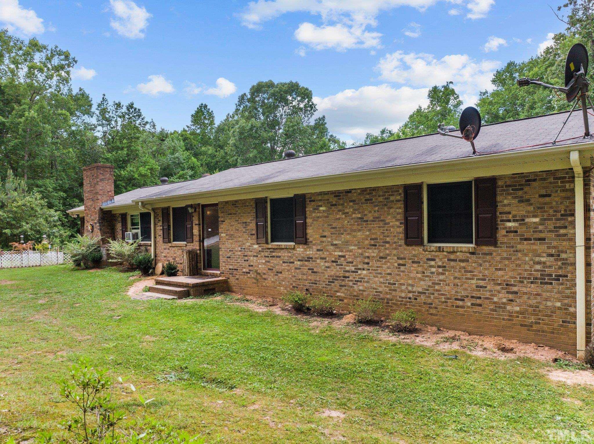 12233 Creedmoor Road Raleigh, NC 27613 - Photo 44 of 57 a front view of a house with patio