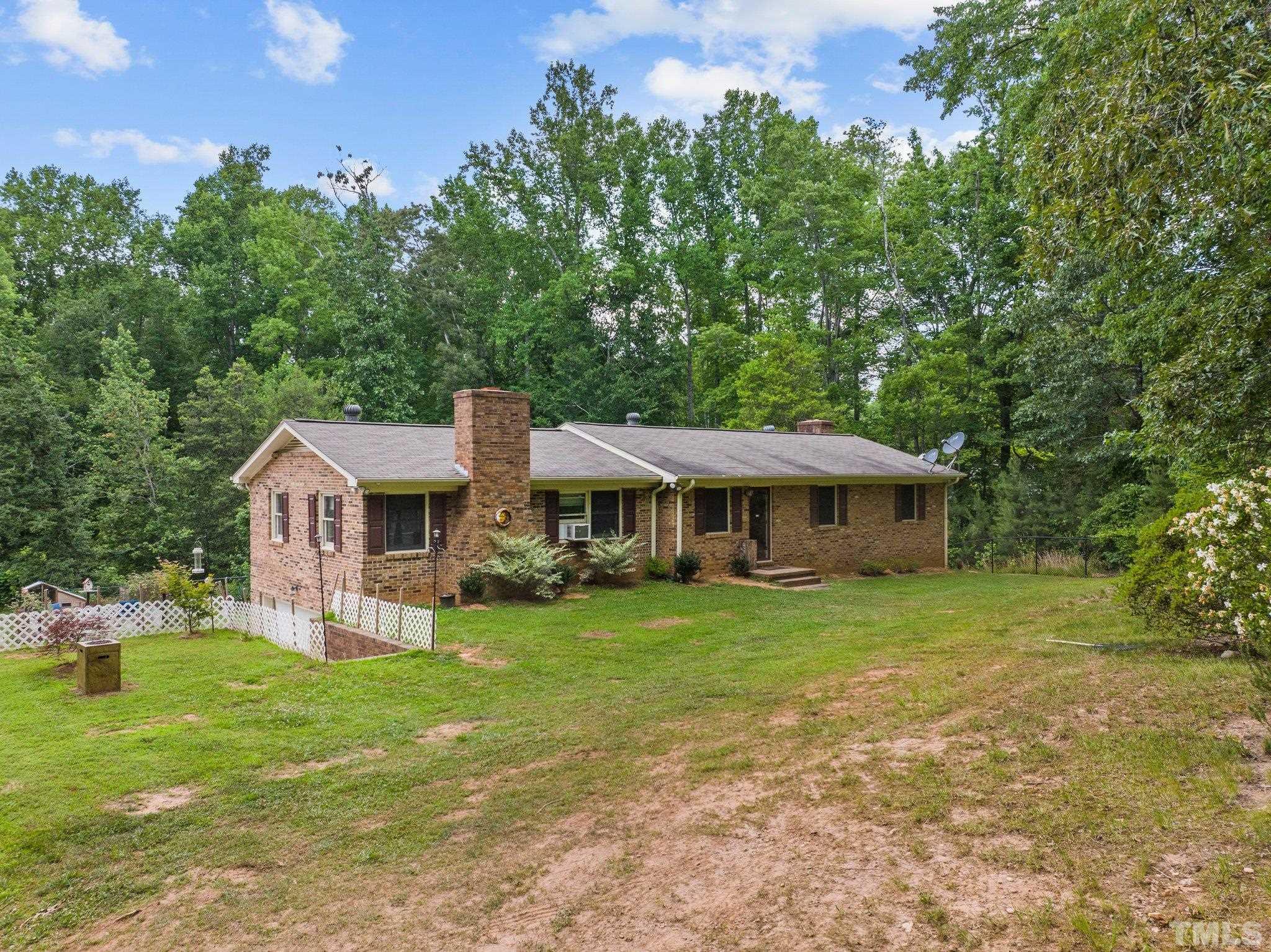 12233 Creedmoor Road Raleigh, NC 27613 - Photo 48 of 57 a front view of a house with garden