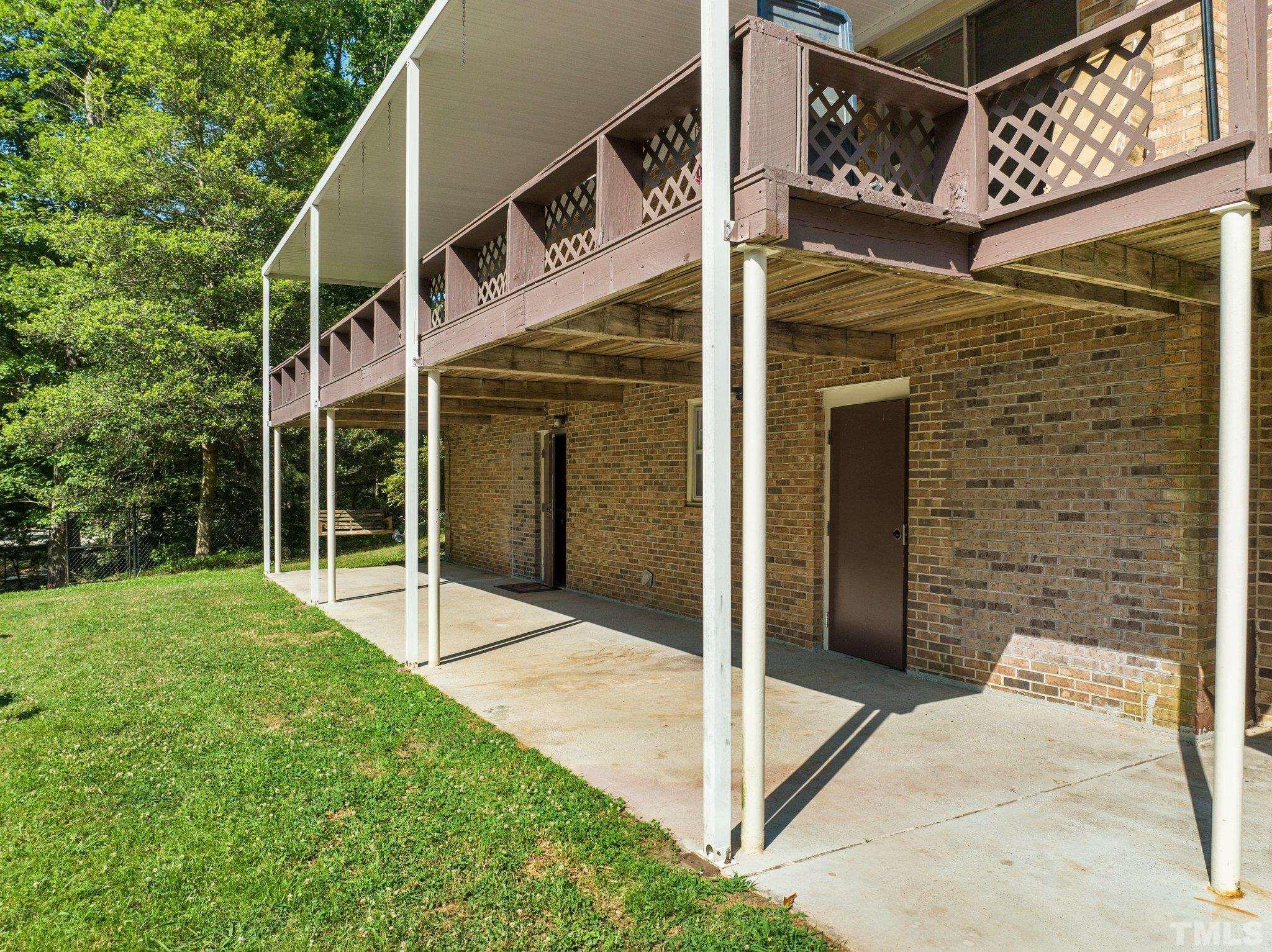 12233 Creedmoor Road Raleigh, NC 27613 - Photo 5 of 57 a view of a house with a backyard
