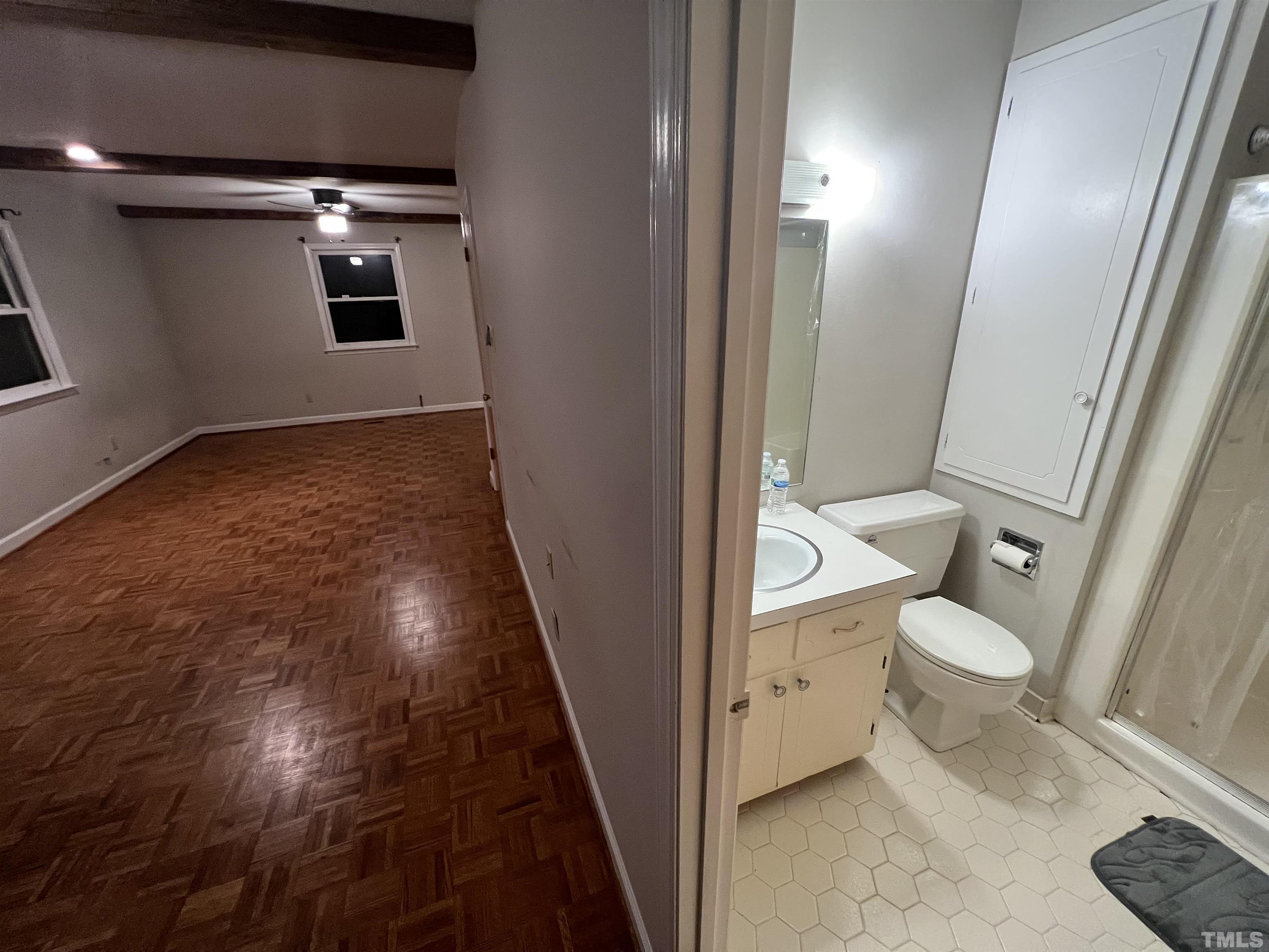 12233 Creedmoor Road Raleigh, NC 27613 - Photo 57 of 57 a bathroom with a granite countertop toilet and a sink