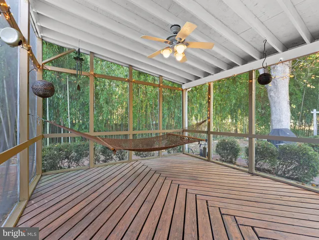 a view of porch with wooden floor and outdoor seating