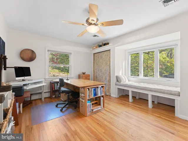 a bedroom with a bed and a table in it