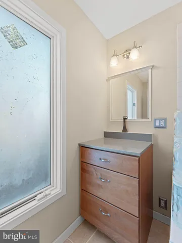a view of a livingroom with furniture and a window