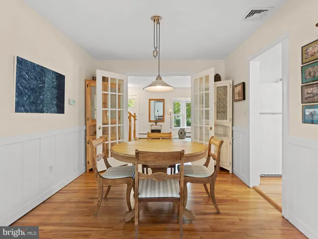 a dining room with furniture window wooden floor