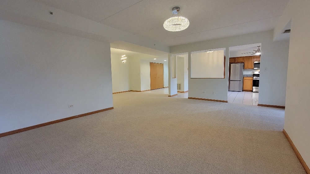 18100 Rita Road, Unit 2D Tinley Park, IL 60477 - Photo 12 of 28 a view of empty room with wooden floor