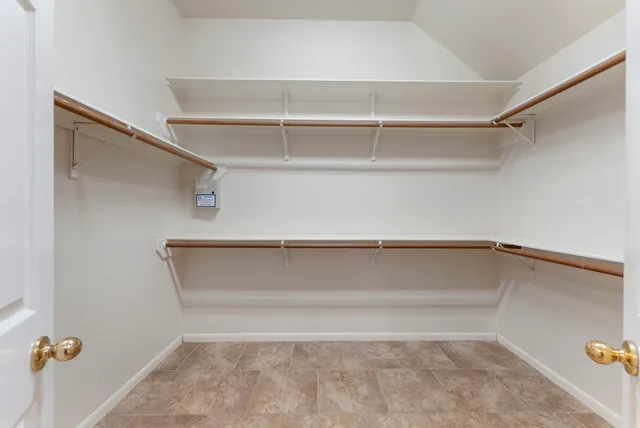 a view of an empty walk in closet