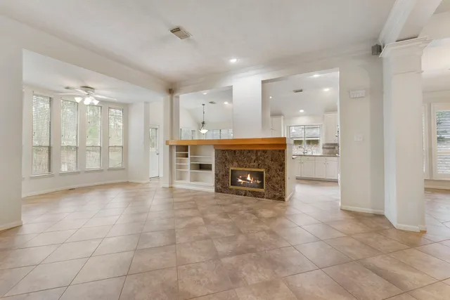 a view of an empty room with a fireplace