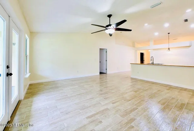 a view of a house with a backyard