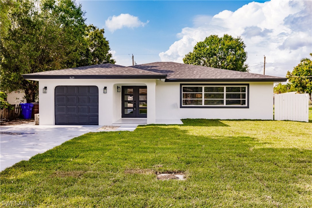 1623 Coronado Road Fort Myers, FL 33901 - Photo 1 of 24 a house view with a backyard space