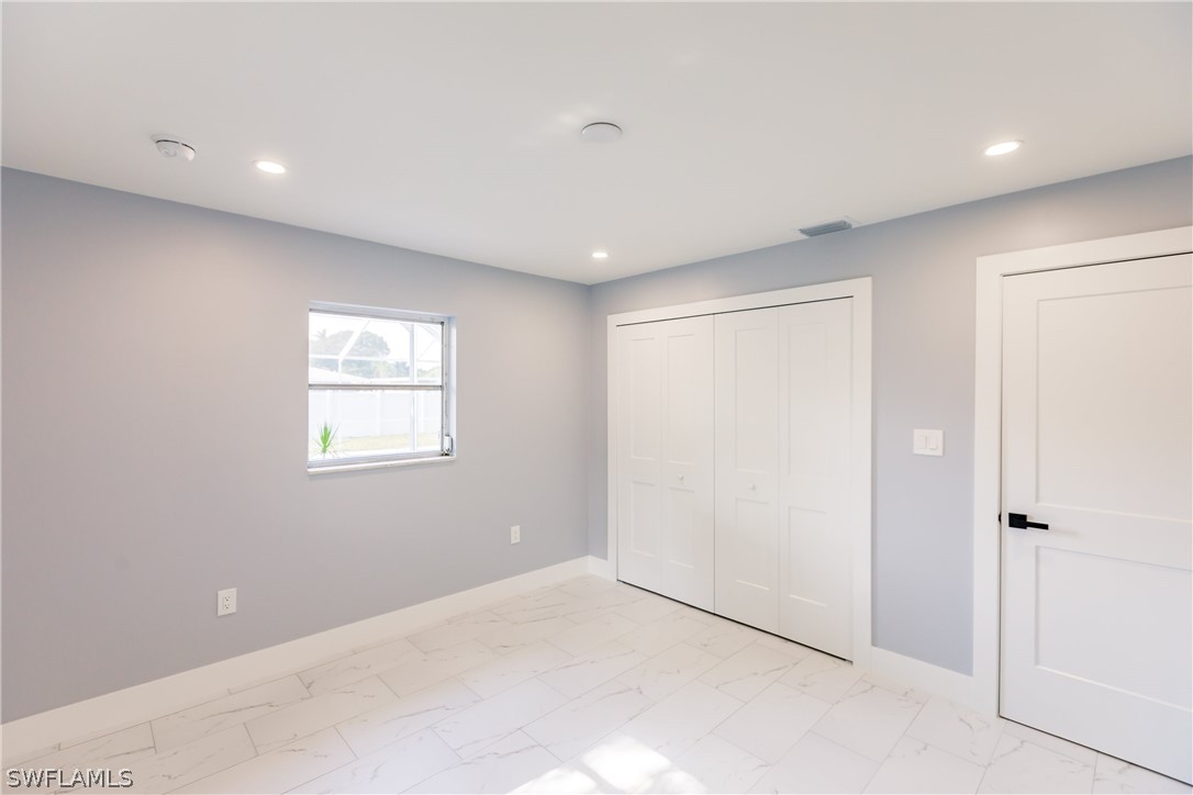1623 Coronado Road Fort Myers, FL 33901 - Photo 14 of 24 a view of an empty room with a window