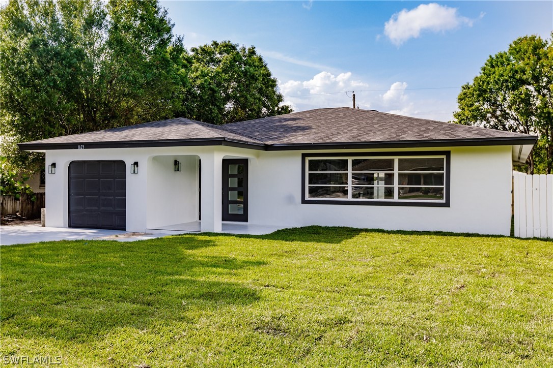 1623 Coronado Road Fort Myers, FL 33901 - Photo 2 of 24 a house view with a garden space