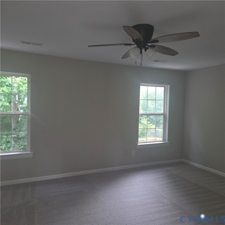 3241 Ransom Hills Road Richmond, VA 23237 - Photo 16 of 24 Neutral-toned walls complement the gray carpeting