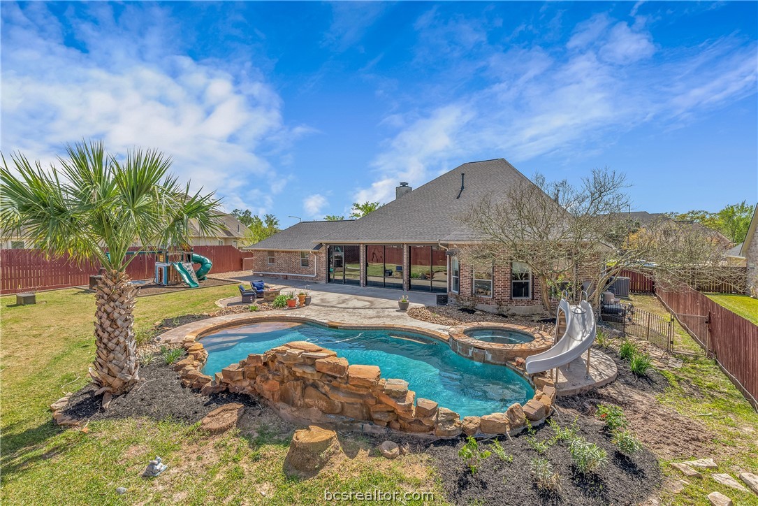 a house with swimming pool in front of it