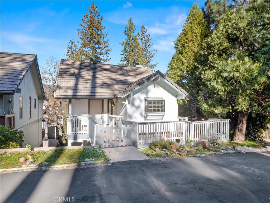 40557 Saddleback Road Bass Lake, CA 93604 - Photo 1 of 31 a view of a house with a yard and sitting area
