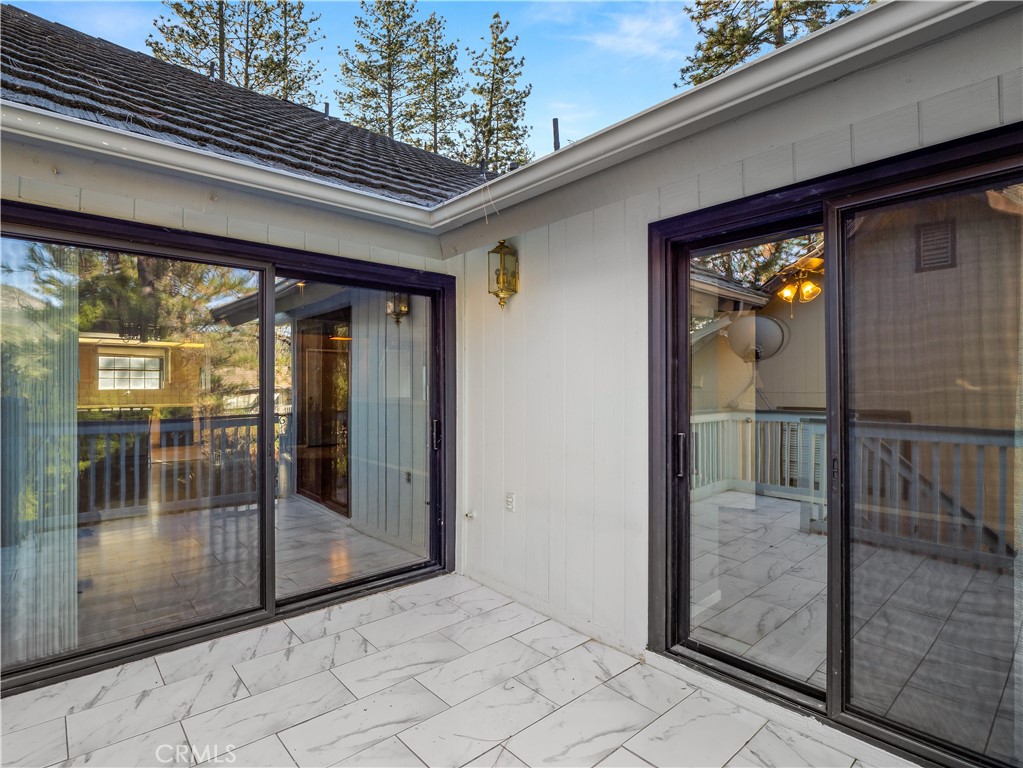 40557 Saddleback Road Bass Lake, CA 93604 - Photo 18 of 31 a view of a glass door of the house