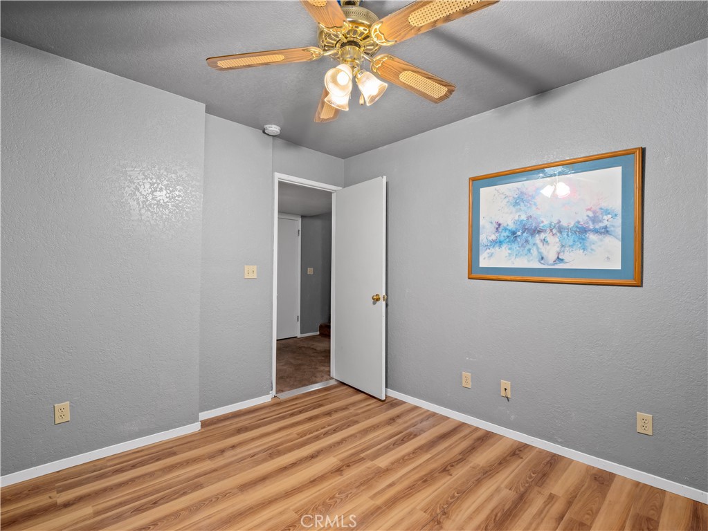 40557 Saddleback Road Bass Lake, CA 93604 - Photo 20 of 31 a view of room with window and ceiling fan