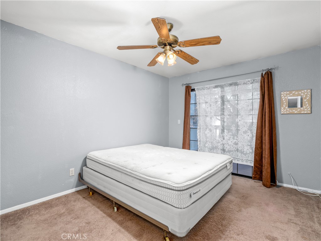 40557 Saddleback Road Bass Lake, CA 93604 - Photo 24 of 31 a bed sitting in a bedroom next to a window