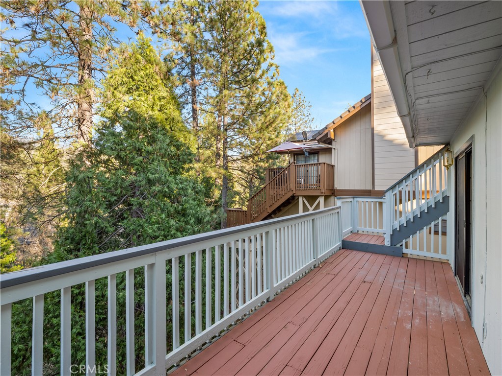 40557 Saddleback Road Bass Lake, CA 93604 - Photo 29 of 31 a view of balcony with wooden floor and fence
