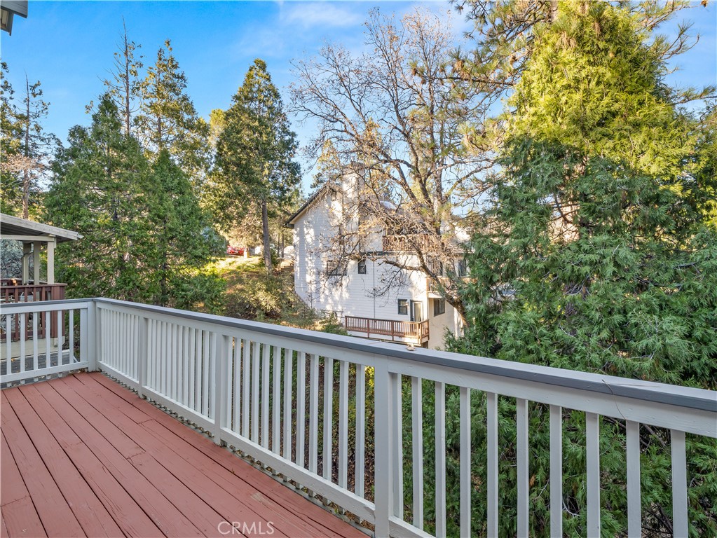 40557 Saddleback Road Bass Lake, CA 93604 - Photo 30 of 31 a view of balcony with wooden floor and fence