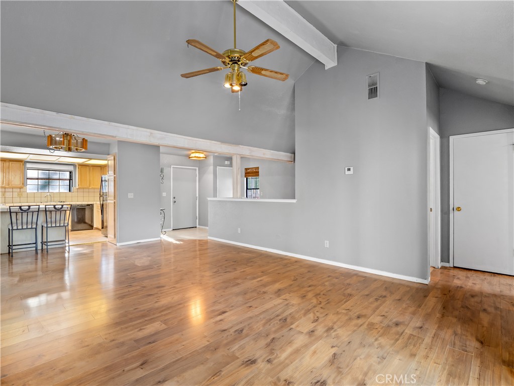 40557 Saddleback Road Bass Lake, CA 93604 - Photo 6 of 31 a view of an empty room with window and wooden floor