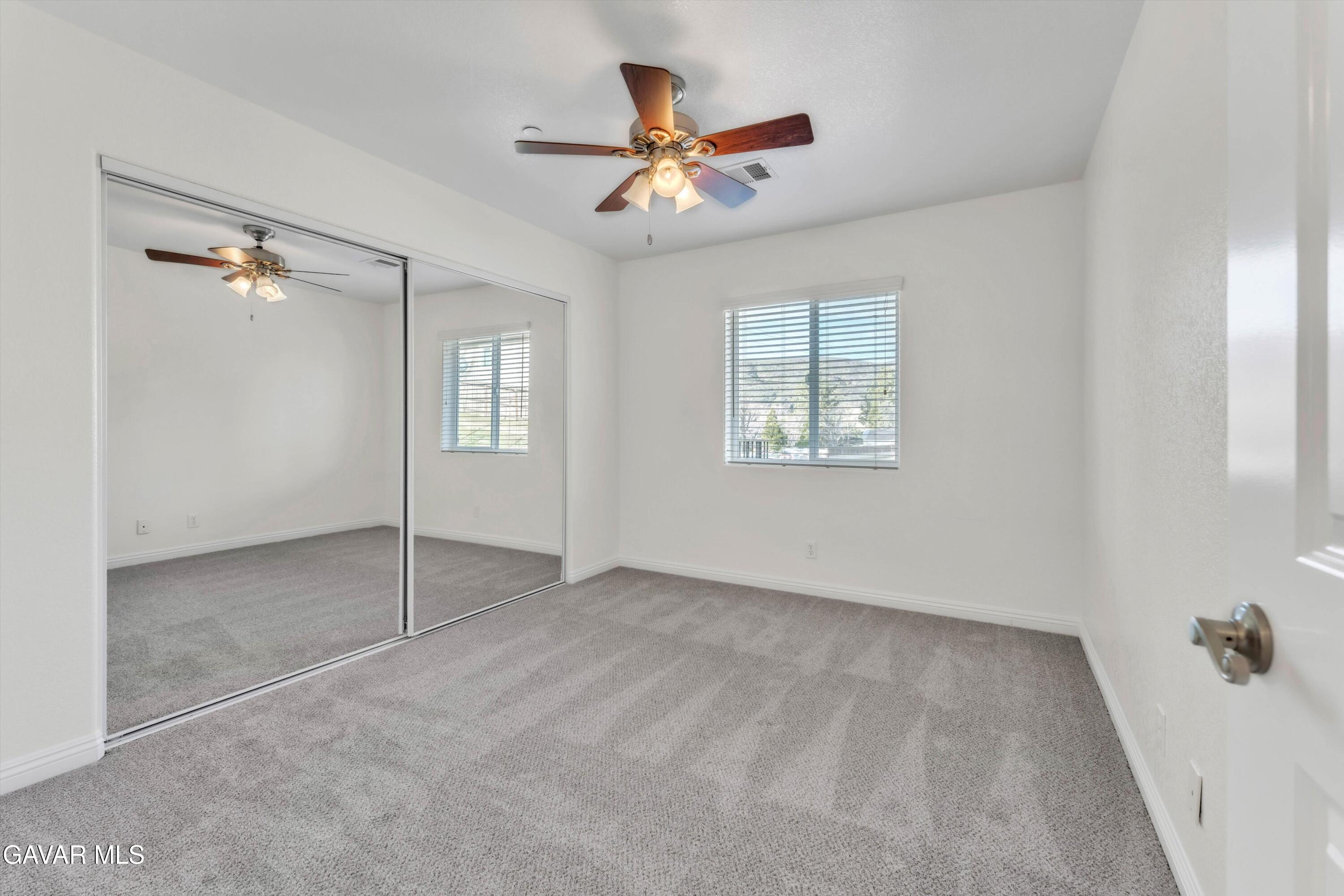 17819 Elizabeth Lake Road Lake Hughes, CA 93532 - Photo 15 of 28 wooden floor in an empty room with a window