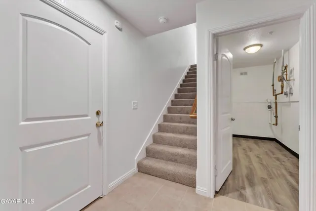 a bathroom with a granite countertop toilet a sink and a bathtub