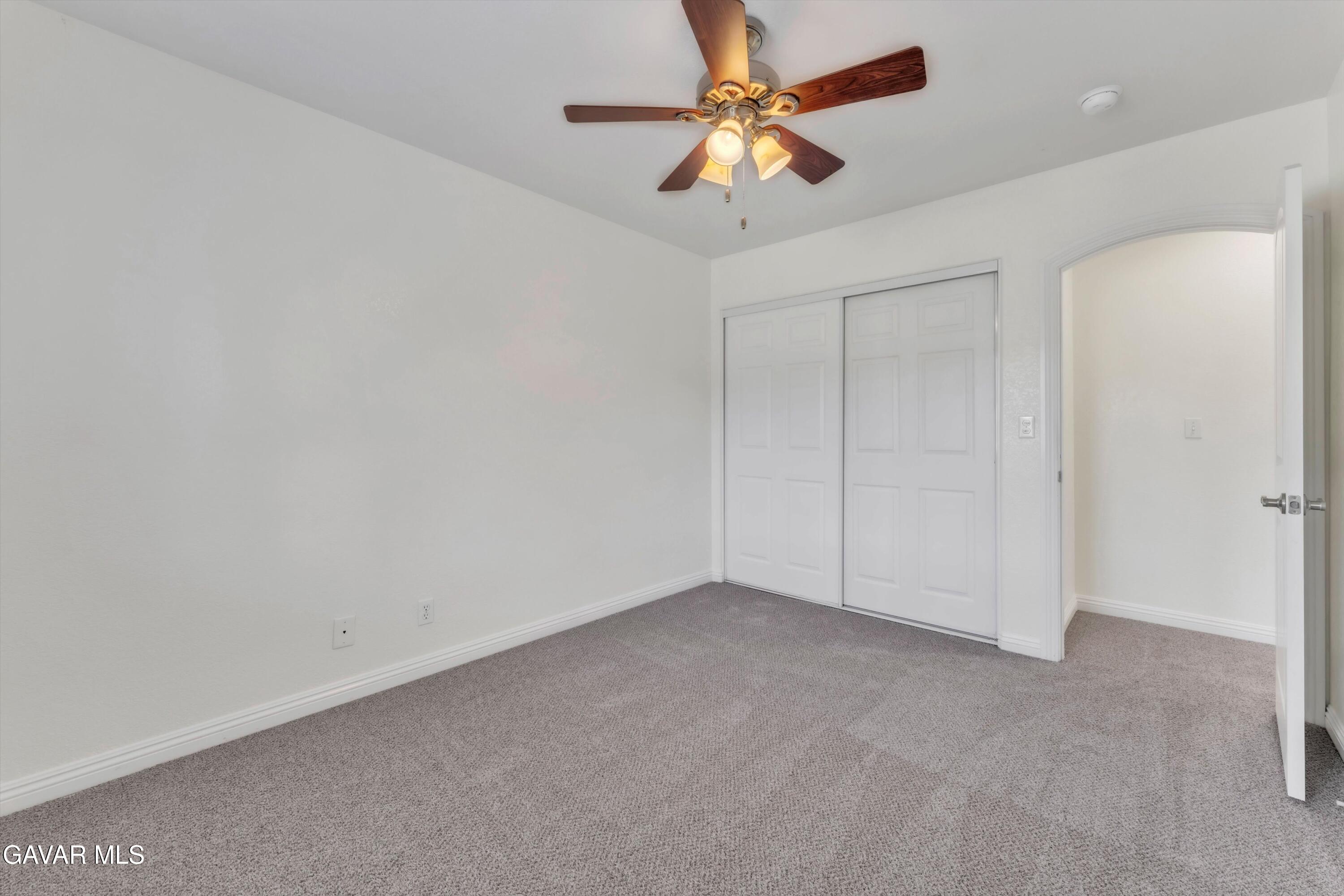 17819 Elizabeth Lake Road Lake Hughes, CA 93532 - Photo 21 of 28 an empty room with a fan and a fan