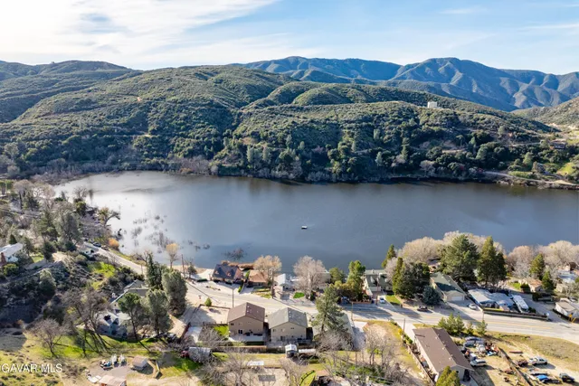 an aerial view of house with mountain view