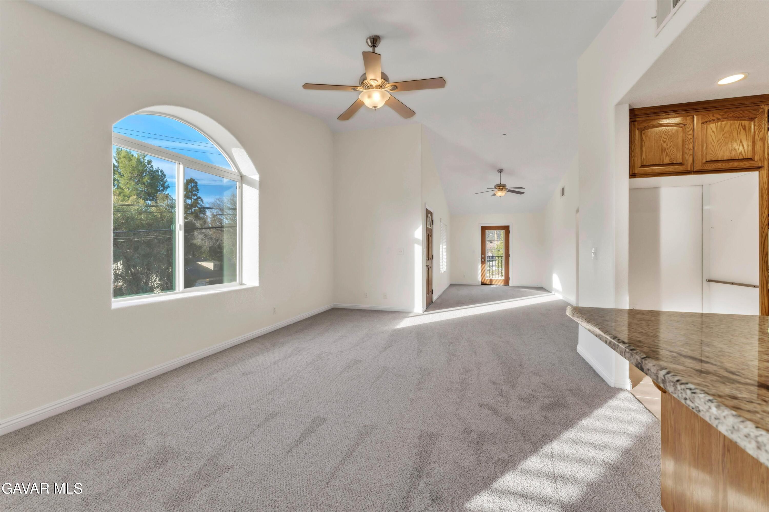 17819 Elizabeth Lake Road Lake Hughes, CA 93532 - Photo 4 of 28 a view of a livingroom with a ceiling fan and window