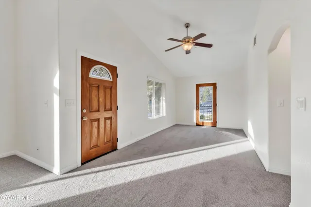 a kitchen with stainless steel appliances granite countertop a stove a sink dishwasher and a microwave oven with cabinets